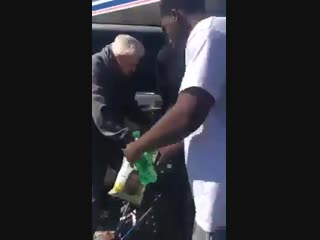 Young gentlemen helping a disabled elderly woman get into her car