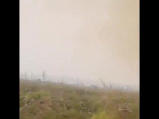 Firefighters get their hose sucked into a 200 ft tall fire tornado