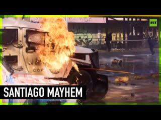 Fire and mayhem descend on santiago on may day