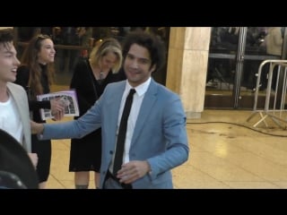 Tyler posey signs for fans outside the blumhouses truth or dare premiere at arclight cinemas cinera