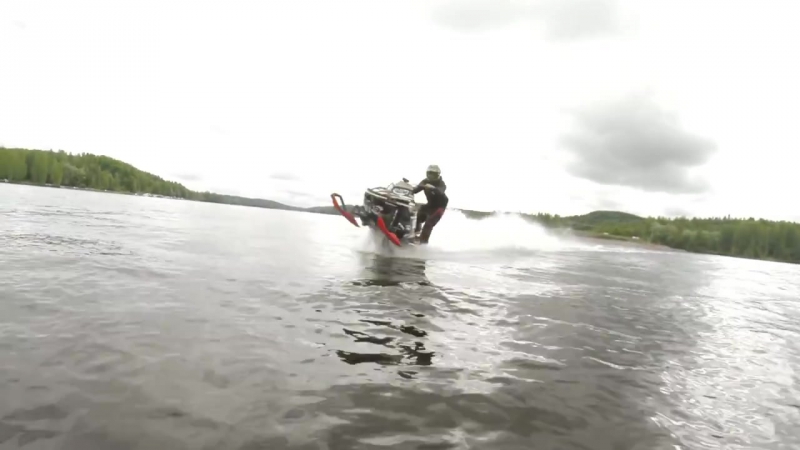 Snowmobile wheelies on water