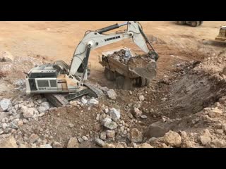 Liebherr 984 excavator loading cat dumpers and operator view sotiriadis brothers