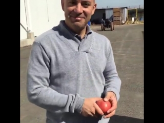 Jeff bezos cracking an apple in half with his bare hands