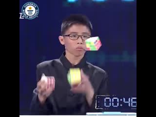 Solve three rubiks cubes at the same time, whilst juggling them