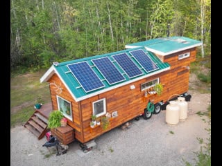 Woman living off grid in her tiny house in northern canada