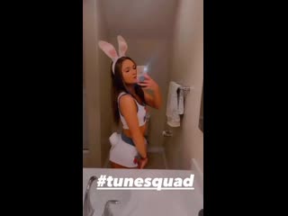 Slim brunette in bunny outfit