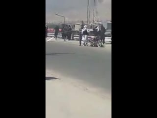 An unarmed taliban member entering kabul was insulted by kabul police mmbr he snatched his white taliban flag checked him th