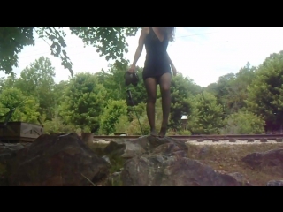 Jess walking on rocks in pantyhose and dress