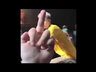 Not impressed eminem fan flips off maching gun kelly to is face as while performing in the audience!