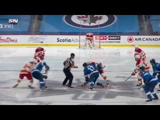 Gotta see it flames defenseman chris tanev beats connor hellebuyck from his own blue line