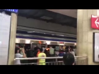 Beijing crowds push train to free man stuck in platform gap