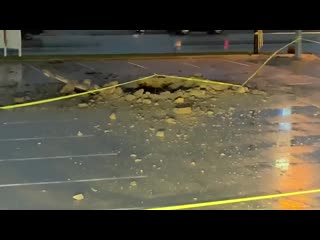 15x15 hole in parking lot cause by lightning strike this morning crews have stabilized the incident no injuries