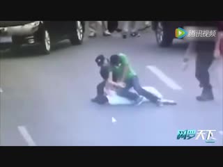 The moment a female chinese swat team officer takes down man wielding a knife in