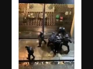 Gang of french police beating gilet jaunes protester in paris