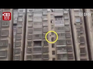 Chinese schoolgirl is saved after plunging 15 storeys