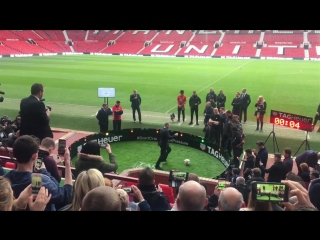 Wayne rooney taking part in a @tagheuer passing challenge at old trafford in his club suit