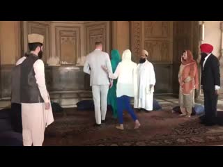 William and kate take their places for an interfaith meeting inside the mosque