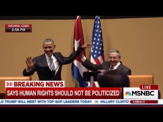 Raul castro raises president obamas limp arm