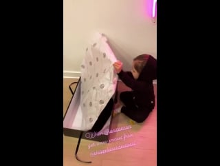 Ioni shows her backpack