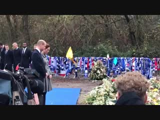 Prince william and kate pay their respects in front of the thousands of flowers that have been laid to honour those who lost the