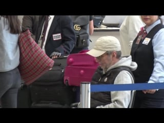 Eric clapton in a wheelchair at lax after canceling shows due to severe bronchitis@29 03 2017