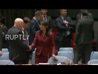 Un us, russian un envoys shake hands prior to unsc meeting