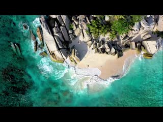 Drawing a large heart figure on the sand of a seashore