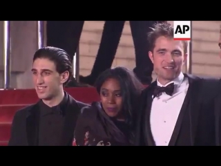 Rob, the safdie brothes, and cast and crew at the red carpet at the cannes premiere of "good time"