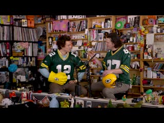 2 green bay packers fans chat behind the tiny desk, and one of them is harry styles