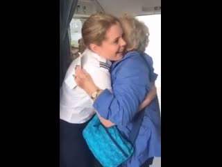 Woman realizing the captain of her flight is her granddaughter