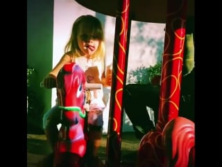 Matthew rutler and summer rain (xtina's daughter) an ice cream on the merry go round