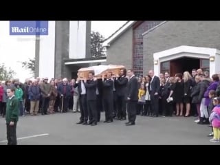 Jim carrey carries cathriona whites coffin at funeral as she is laid to rest