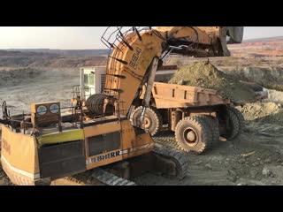 Liebherr 994 mining shovel excavator loading dumpers and operator view