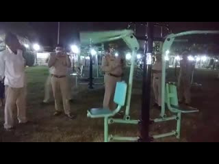 Watch an exercise machine in an open gym in a jhansi park rocking all by itself