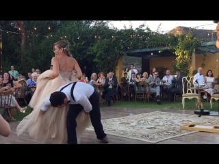 Bride puts a spell on her magician groom during first dance