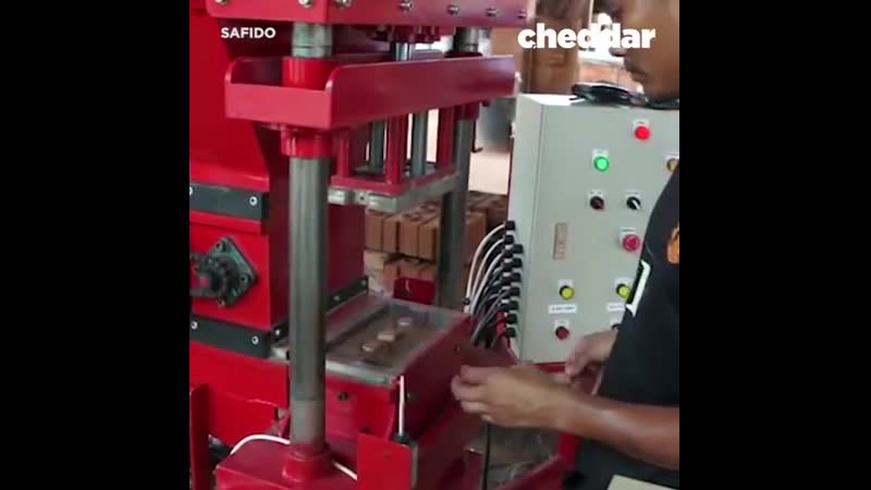 This hydraulic machine compresses dirt to make bricks