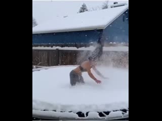 Backflip on a snowy trampoline