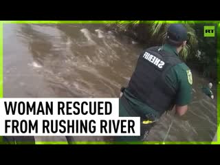 Florida deputies rescue woman whose car was swept away by rushing river