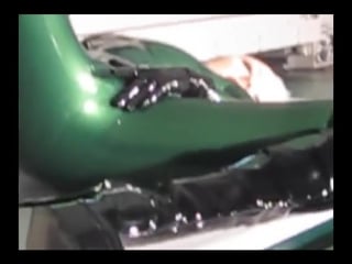 Green metallic latex catsuit