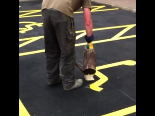 Guy paints handicap symbols