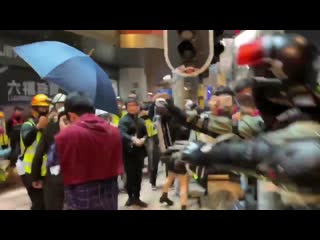 Politician tries to communicate, cop grabs his goggles twice and sprays him