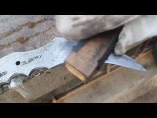 Turning a rusty bearing into a shiny but razor sharp karambit