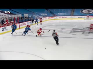 Gotta see it flames defenseman chris tanev beats connor hellebuyck from his own