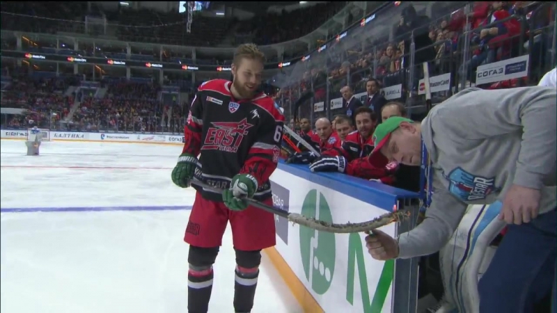 Linus omark tries to score with a burning stick at khl asg16