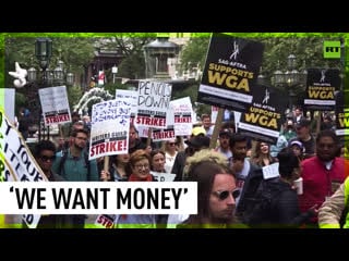 Hollywood writers rally in nyc demanding payment guarantees