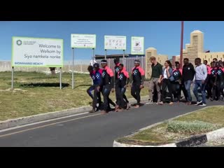 Slight change of location but meghan and harry are finally here at monwabisi beach