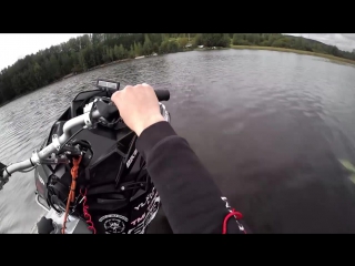 Snowmobile wheelies on water