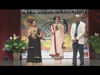 Meenakshi seshadri giving her message at texas star kalakaar 2016