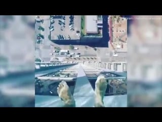 Glass bottomed pool on 42nd floor jets out into thin air so swimmers can see 500 feet below!!!