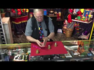 Doc grimes performing his “guerrilla” cups and balls